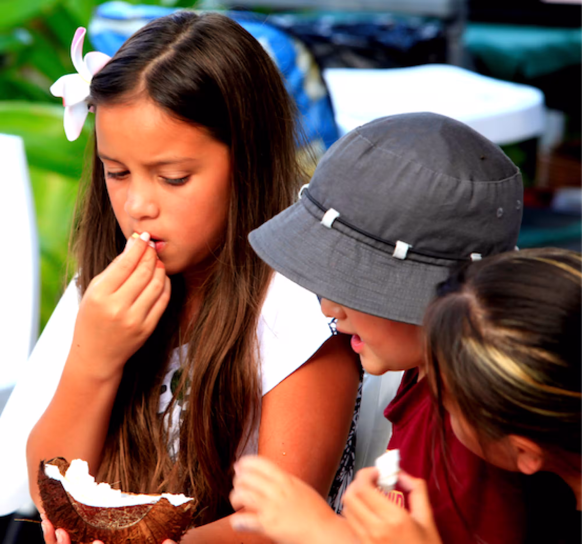 Child eating coconut at The Brasserie Restaurant at Edgewater Resort & Spa